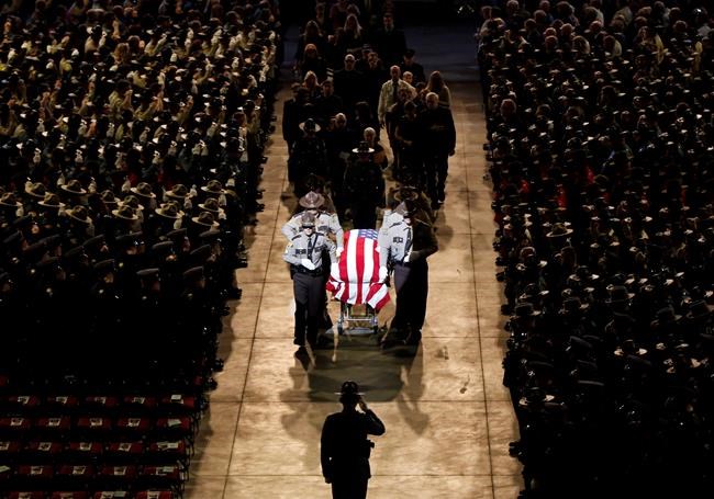 Thousands join law enforcement in tribute to fallen deputy | iNFOnews.ca CP371797560