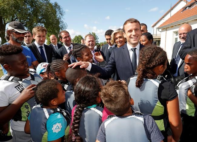 French president visits children at charity holiday program | iNFOnews.ca