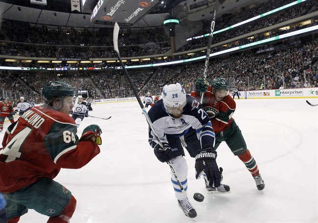 Hellebuyck hangs on to win debut in goal; Byfuglien scores, adds assist and Jets beat Wild 3-1 | iNFOnews.ca CP35485935