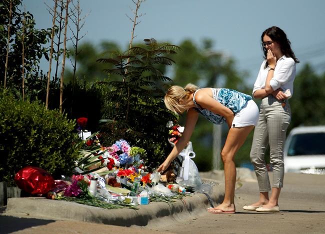 The Latest: Woman gives survivors flowers at boat memorial | iNFOnews.ca