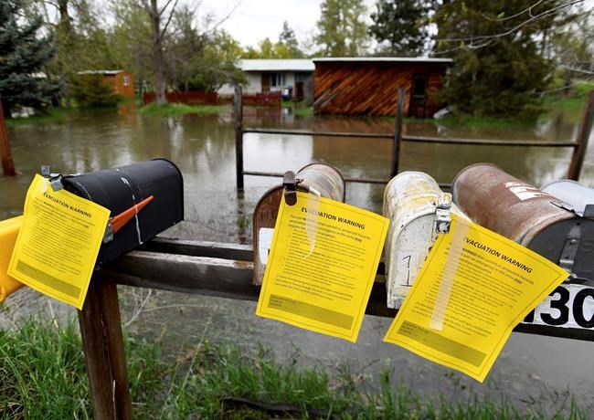 Montana floodwaters submerge neighbourhood, threaten others | iNFOnews.ca Montana floodwaters submerge neighbourhood, threaten others | iNFOnews.ca
