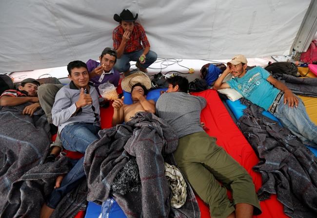 The Latest: Aid workers help migrants at Mexico City stadium | iNFOnews.ca CP258112893