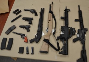 Firearms and ammunition seized by RCMP in Lake Country on display.