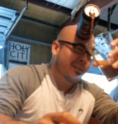 Guy pours beer with forehead | iNFOnews.ca
