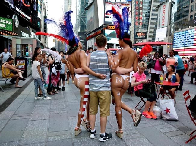 Topless, painted women ignite latest furor over 'aggressive' characters in NYC's Times Square | iNFOnews.ca Topless, painted women ignite latest furor over 'aggressive' characters in NYC's Times Square | iNFOnews.ca
