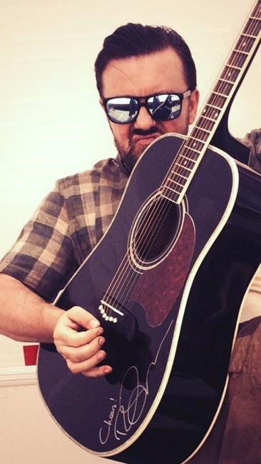 Ricky Gervais guitar being auctioned off by sanctuary housing Ikea monkey | iNFOnews.ca