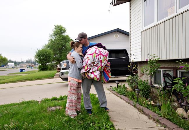 Returning Fort McMurray residents finding smelly refrigerators, dandelion lawns | iNFOnews.ca