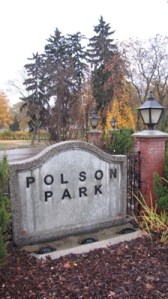 A concrete Polson Park sign at the park.