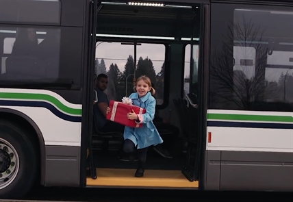 A child exiting a public bus.