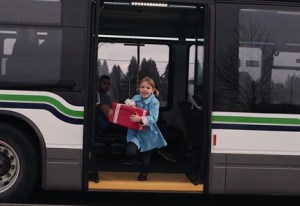 A child exiting a public bus.