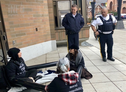 UPDATE: Animal rights activists arrested after shutting down Kelowna Interior Savings branch | iNFOnews.ca UPDATE: Animal rights activists arrested after shutting down Kelowna Interior Savings branch | iNFOnews.ca