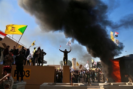 Protesters attack US Embassy in Baghdad after airstrikes | iNFOnews.ca