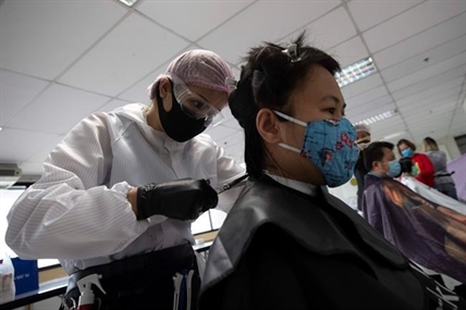 Retailers add COVID-19 surcharge for services to help offset costs of pandemic | iNFOnews.ca