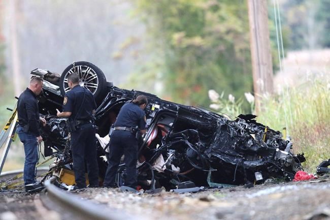Porsche SUV plunges onto train tracks, burns; 2 teens die | iNFOnews.ca