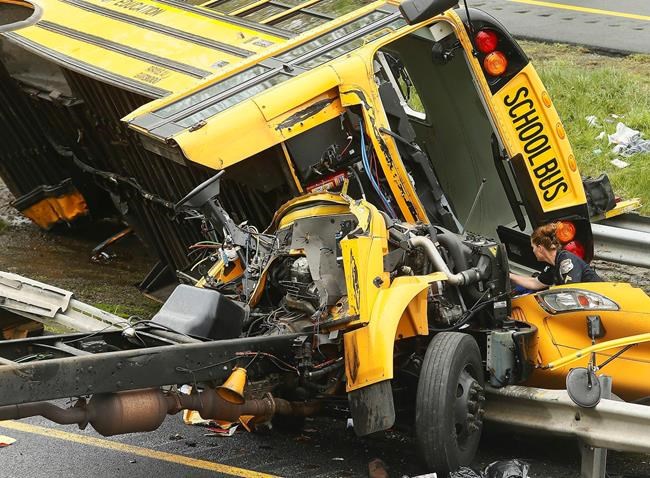 The Latest: Crews move school bus wrecked in deadly crash | iNFOnews.ca
