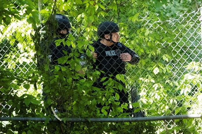 Man who held cops at bay for 35 hours is charged with murder | iNFOnews.ca