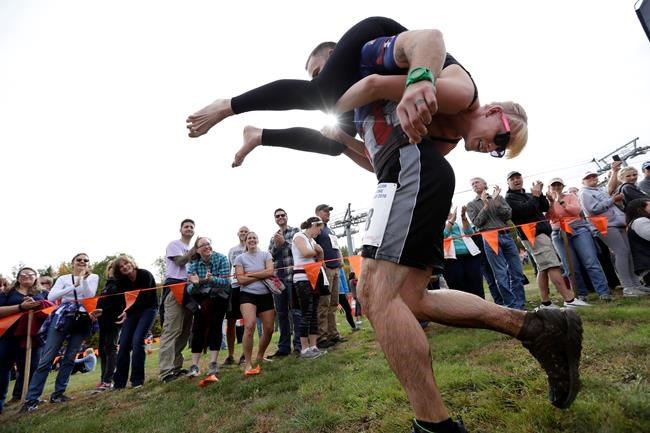 Have wife will carry: Couples vie in wife-carrying contest | iNFOnews.ca Have wife will carry: Couples vie in wife-carrying contest | iNFOnews.ca