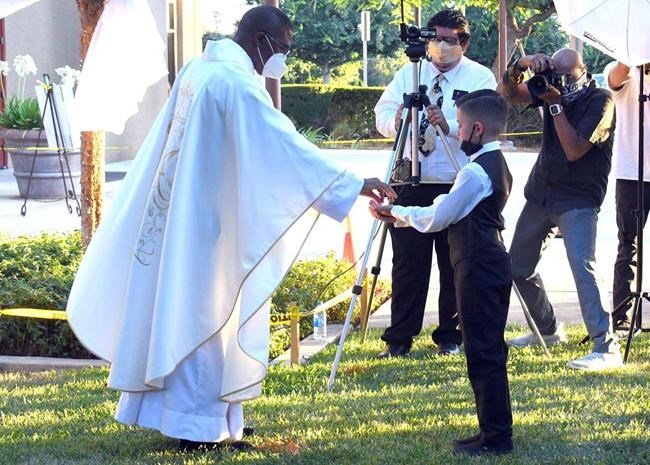 Catholics resume First Communions and baptisms outdoors | iNFOnews.ca