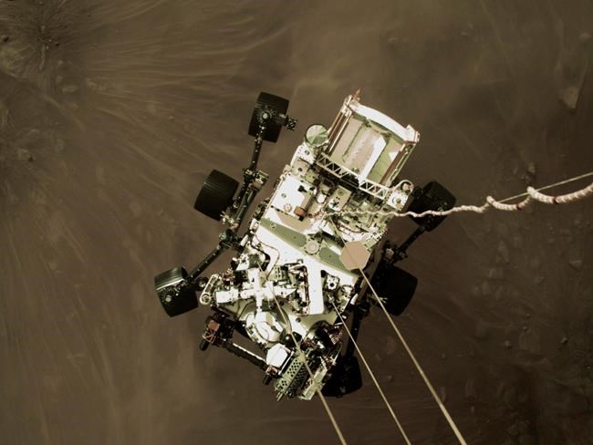 Mars landing team 'awestruck' by photo of descending rover | iNFOnews.ca