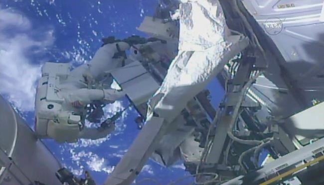 Spacewalking astronauts perform pump swap at space station | iNFOnews.ca CP905759539