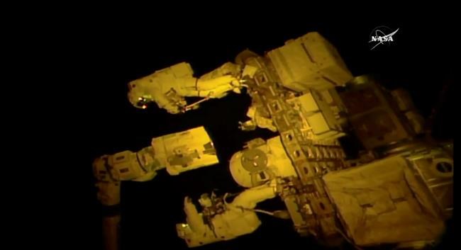 Spacewalking astronauts give new hand to robot arm | iNFOnews.ca