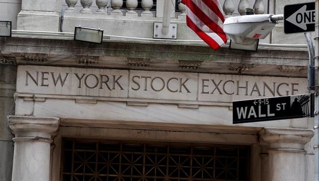 US stocks close slightly lower as investors wait for Fed | iNFOnews.ca