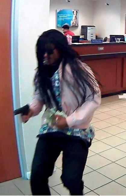 Police: Bank teller shot by gunman with big wig, pink jacket | iNFOnews.ca