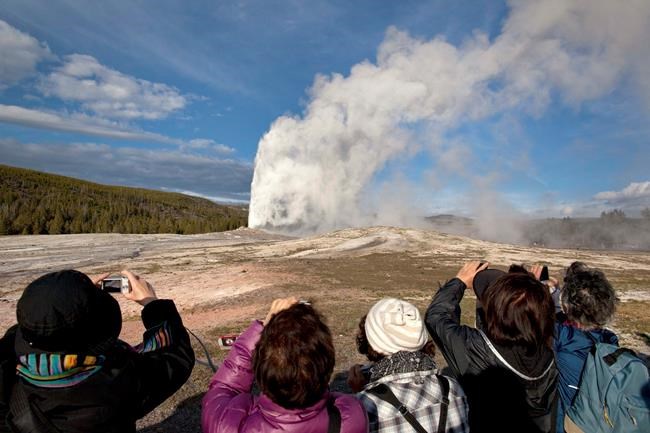2 men banned from park for years for walking on Old Faithful | iNFOnews.ca