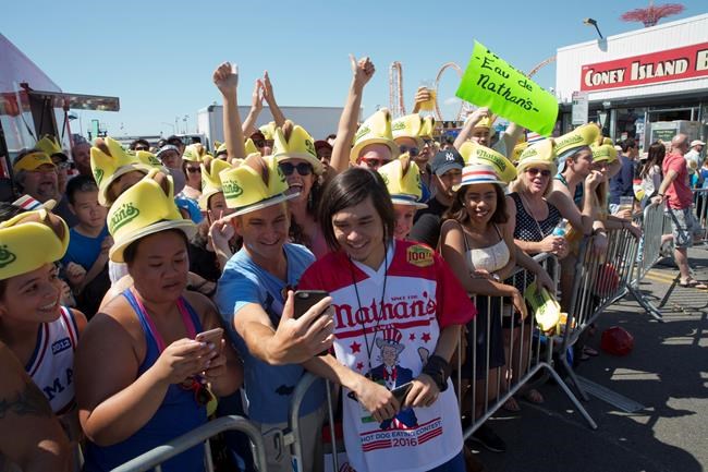The Latest: Defending champ wins women's hot dog contest | iNFOnews.ca The Latest: Defending champ wins women's hot dog contest | iNFOnews.ca
