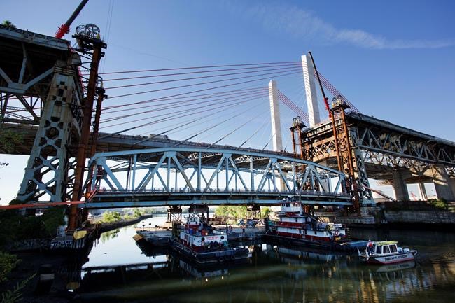 Bridge on a barge: Old span dismantled, shipped down creek | iNFOnews.ca