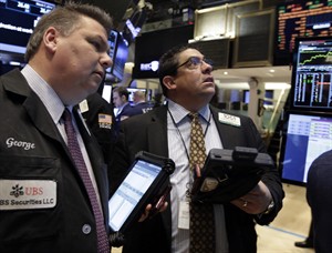 US stocks mostly lower as tensions build in Ukraine, offsetting a pickup in hiring last month | iNFOnews.ca CP27497341