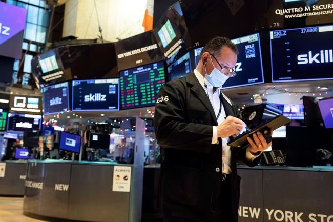 Asian stocks sink after Wall St hits record on stimulus hope | iNFOnews.ca