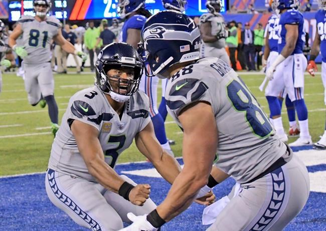 Wilson throws 3 second-half TDs, Seahawks D dominates | iNFOnews.ca