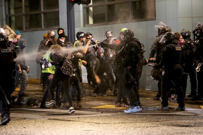 Portland protesters set fire at police building, 14 arrested | iNFOnews.ca Portland protesters set fire at police building, 14 arrested | iNFOnews.ca