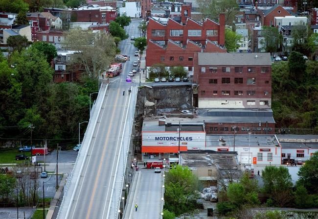 Retaining wall, parking lot collapse onto businesses below | iNFOnews.ca