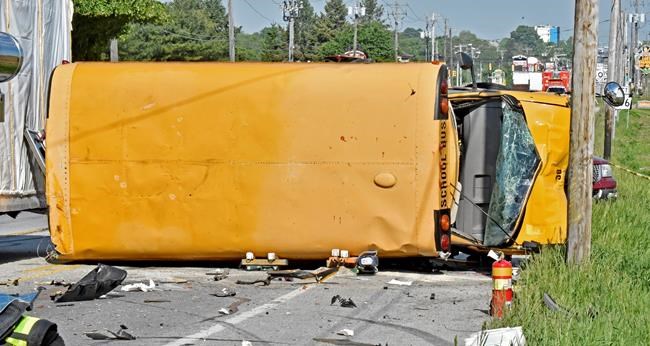 School bus flips in hit-and-run crash; 16 taken to hospital | iNFOnews.ca School bus flips in hit-and-run crash; 16 taken to hospital | iNFOnews.ca