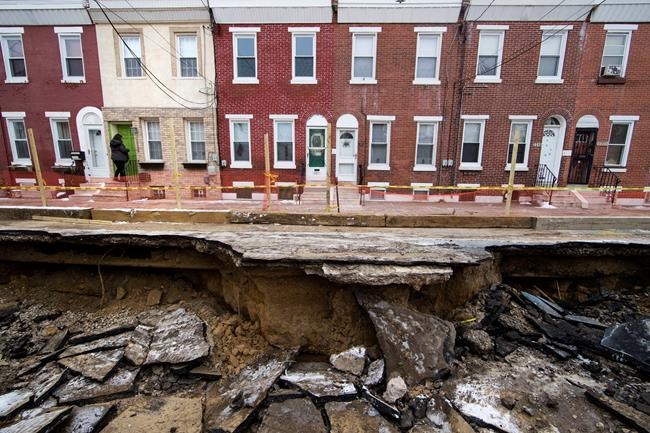 Philly sinkhole swallows car, interrupts utility services | iNFOnews.ca Philly sinkhole swallows car, interrupts utility services | iNFOnews.ca