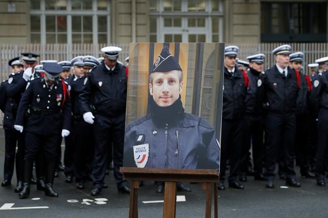 France honours police officer killed in Champs-Elysees attack | iNFOnews.ca CP579144557