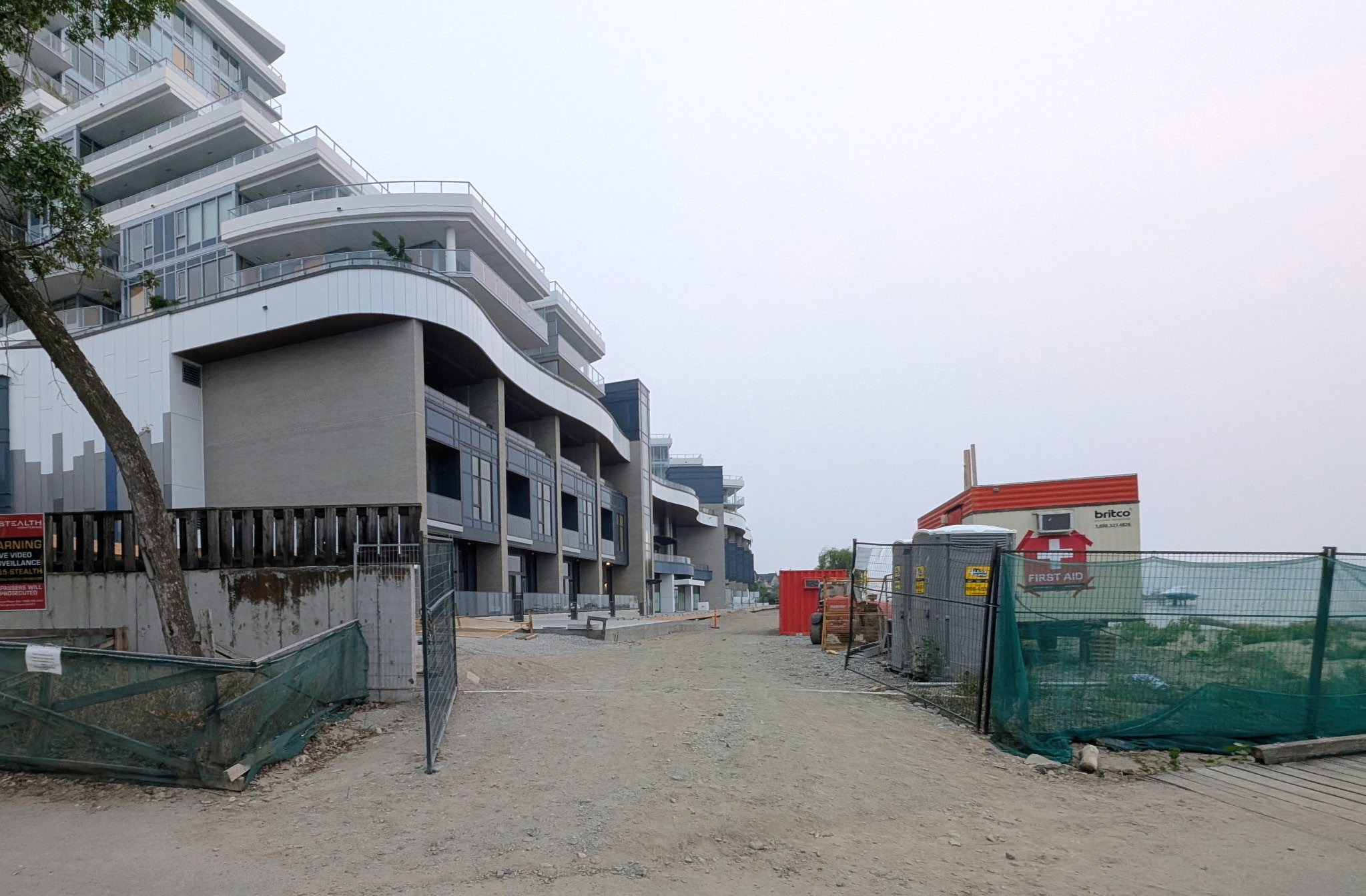 A lakeshore path in front of a condo development.