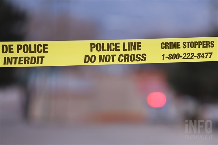 An image of police tape with the Crime Stoppers number on it.