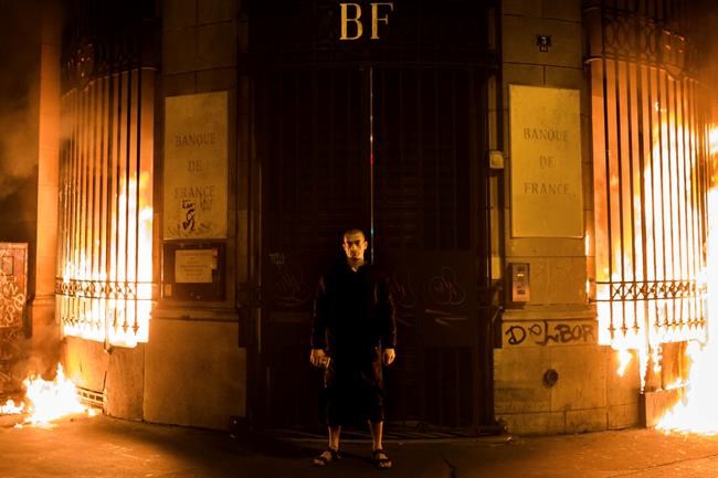 Russian performance artist sets fire to Paris bank | iNFOnews.ca