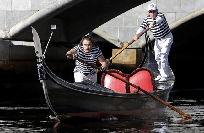 The Latest: Venetian-style gondoliers race in contest | iNFOnews.ca