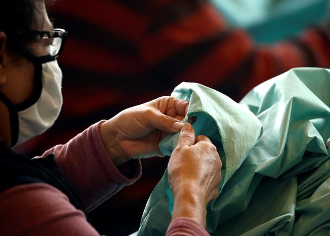 Luxury menswear maker Samuelsohn starts making surgical gowns in Quebec | iNFOnews.ca CP2124203208