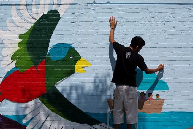 Migrants paint hopes and dreams on murals | iNFOnews.ca Migrants paint hopes and dreams on murals | iNFOnews.ca
