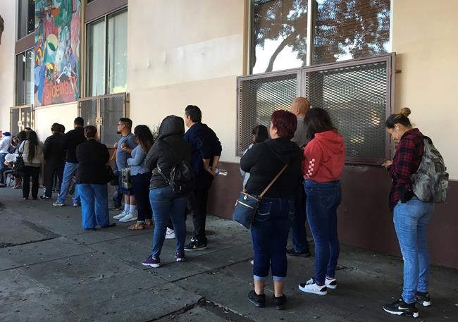 Immigrants line up to renew work permits as program ends | iNFOnews.ca