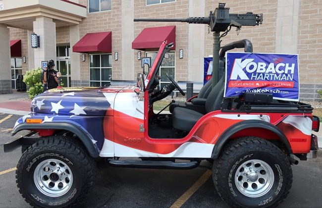 After balking, Kansas parade won't bar Kobach's replica gun | iNFOnews.ca