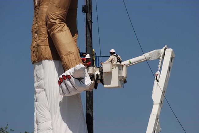 Giant puppet takes on worries stuffed into "gloom box" | iNFOnews.ca