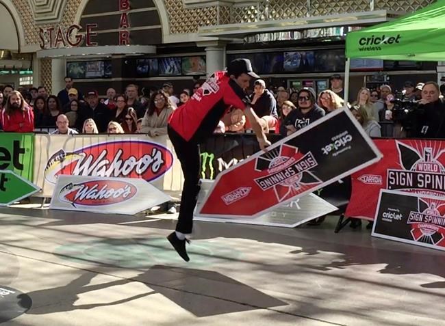 Sign spinners' moves nab attention on street and at contest | iNFOnews.ca Sign spinners' moves nab attention on street and at contest | iNFOnews.ca