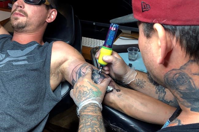 Tattoo artist sees bump in desire to erase hateful skin art | iNFOnews.ca CP839993592