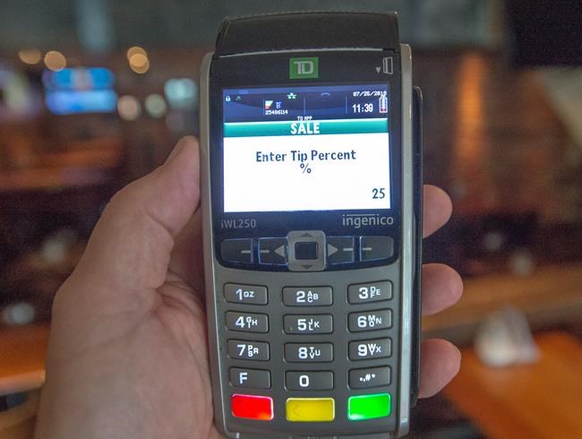 Cashless consumers face tipping quandary for over-the-counter service | iNFOnews.ca CP574986240